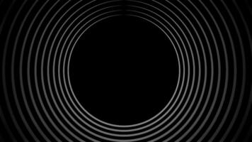 Expanding concentric circles creating a tunnel effect on black background. Motion video