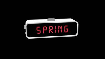 Spring word on digital alarm clock screen video