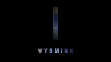 Wyoming state shape in glassy 3D design with dark background video