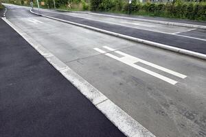 Urban Road Infrastructure with Bus Lane and Pedestrian Symbols for Traffic Management photo