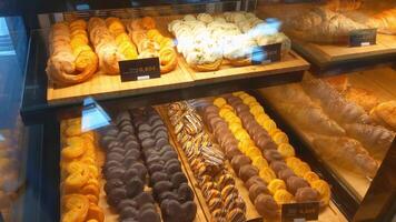 A display case filled with various pastries photo