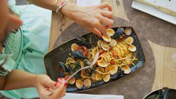 Gourmet Spaghetti Dish With Clams And Mussels On The Summer Restaurant Table Outside video