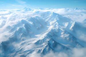 Majestic Snow-Capped Mountain Range Above Clouds in Serene Winter Wonderland photo