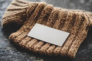 Rustic Autumn Fashion Concept with Knitted Sweater and Blank Card for Branding or Message photo