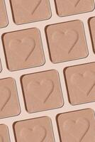 Minimal pattern eye shadow neutral beige swatches with shadow, monochrome photo, eyeshadow with heart imprint, skin colored powder for makeup, square shape metal pack, beauty cosmetic texture vertical photo