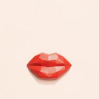 Kissing woman lips red colored on light set sail champagne colored. Greeting card design, minimal style, love concept photo