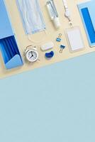 New normal concept workspace desk school Geometric pattern with office supplies and ppe. photo