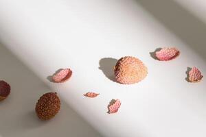 Fresh Lychee fruit on light background. Minimal fruit and summer concept. photo