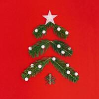 Creative Christmas pattern with green Christmas tree and snow, New Year composition. Minimal flat lay. photo
