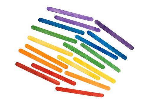 Rainbow color wooden ice cream sticks on white. Multicolored abstract photo
