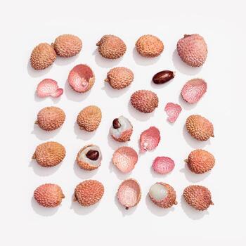 Fresh Lychee fruit on white background. Food pattern inscribed in rectangle. photo