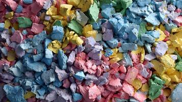 Abstract composition displaying a delightful array of fragmented colored chalk pieces in vibrant hues photo