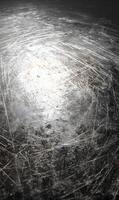 Abstract metallic texture with a captivating silvery glow featuring an intriguing scratched surface pattern photo