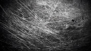Intricate textures and patterns of scratched metal surface create an abstract and industrial feel photo