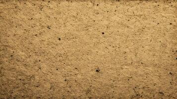 Rustic aged paper texture with subtle dark specks creates an abstract and organic background design photo