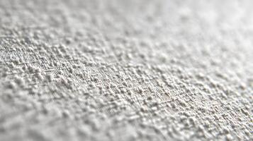 Elegant close up of a textured white fabric surface showing a delicate woven pattern for creative use photo
