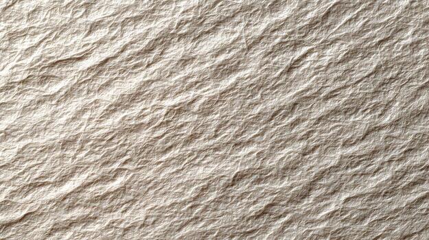 A close up view of wrinkled paper with a pale cream color and a diagonal orientation showing the texture photo