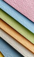 Colorful textured paper layers creating a vibrant pattern with delicate pastel hues and a soft light creating a gradient effect photo