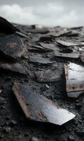 Shattered landscape a monochrome symphony of broken slate tiles under a somber sky revealing a desolate tableau photo