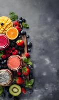 Assortment of colorful smoothies and fresh fruits on a dark moody background creating a vibrant and healthy presentation photo