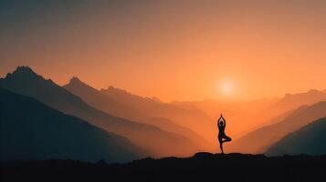 Silhouette of a serene woman practicing yoga in a mountainous landscape at a beautiful sunset light photo
