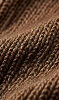 Warmth and Texture A Captivating Close Up View of a Knitted Brown Wool Fabric Garment photo