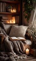 Cozy corner for relaxation and reading with soft blanket book and warm candle light perfect for unwinding photo