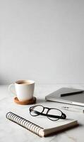 Workplace serenity a cup of coffee beside a laptop and notebook inviting focus and productivity neutral palette photo
