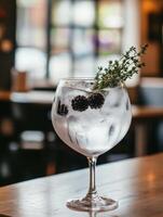 Restaurant Specialty Gin Tonic Featuring Blackberry and Thyme photo