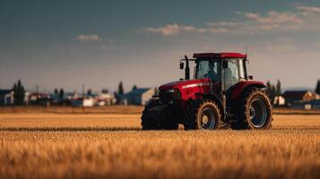 A striking crimson tractor rests within a field of mature wheat photo