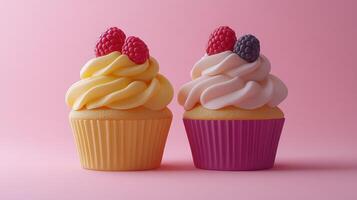 Two adorable cupcakes, topped with raspberries and blackberries, sit side-by-side on a pastel pink background photo
