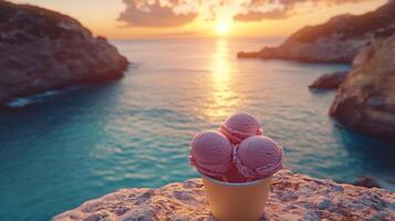 Pink ice cream scoops at sunset over the sea photo