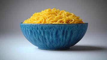 Pile of yellow noodles in a blue bowl photo