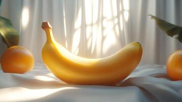 Golden banana and oranges on a soft cloth, bathed in sunlight photo