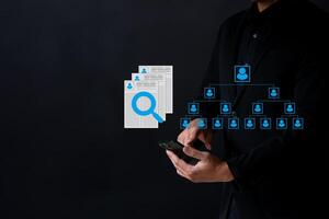 Business man work with smartphone seek data to find a new job icon are floating on screen of tablet. photo