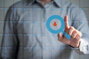 The Business man work point finger seek data to find a new job icon are floating on screen photo