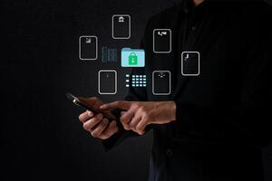 The business man work with laptop seek data folder are locking icon floating on screen photo