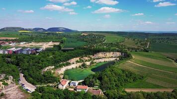 Aerial view of Mikulov flooded quarry in May 2025 in Czechia video
