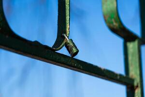 Iron handrails with a lock on them. Love lock on the railing photo