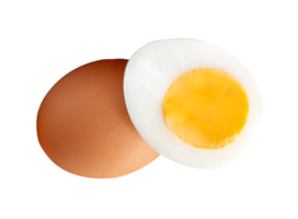 A raw brown chicken egg and cooked or boiled chicken egg with egg yolk in half in small pile isolated with clipping path in file format png