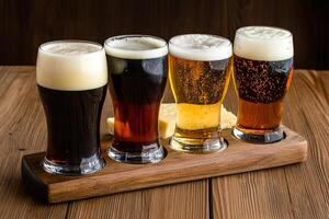 A group of four different types of beer on a wooden tray photo