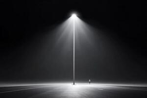 A lone person standing in the middle of a street light photo