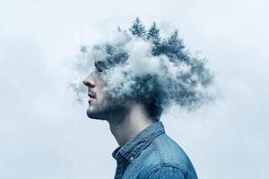 A man with a clouded head and trees in his head photo