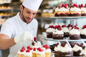 A man in a chef hat is cutting a cake photo
