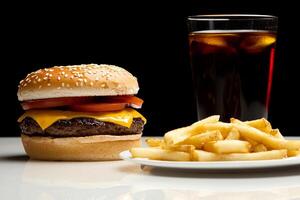 A hamburger and fries on a plate photo