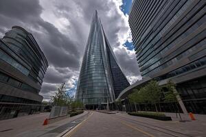 A large building with a tall tower in the background photo