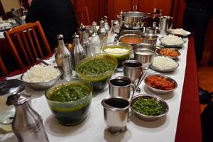 A table with many dishes of food photo