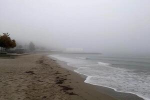 A beach in the fog with a beach house photo