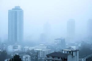 Foggy cityscape with tall buildings in the background photo