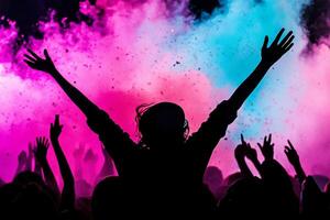 A person with their hands up in front of colored powder photo
